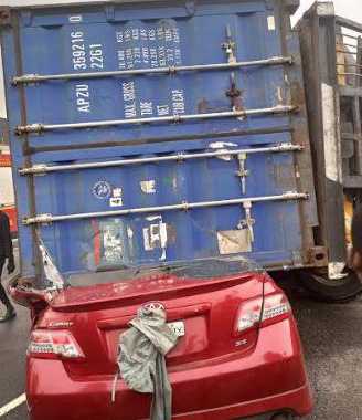 Driver Escape Death, As 40ft Container Crushes Car in Lagos